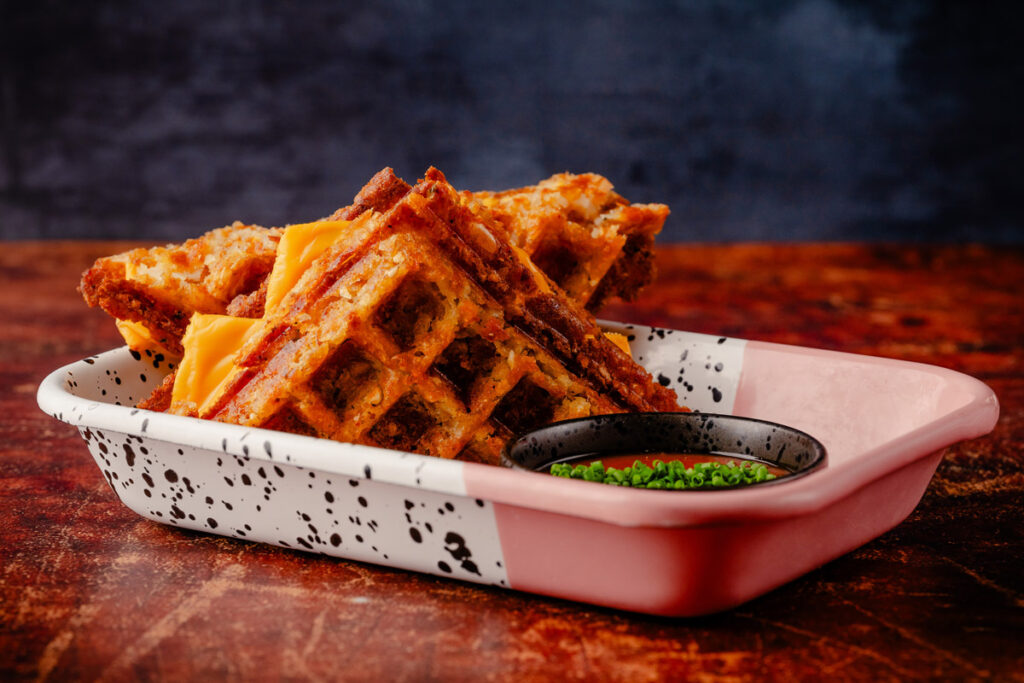 RC3-January25-FullAlbum-52 A grilled cheese made with crispy golden hash brown waffles, a melty four-cheese blend, served with a spicy tomato dipping sauce.